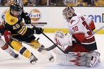 BOSTON, MA - OCTOBER 18:  Cam Ward #30 of the Carolina Hurricanes blocks a shot by Rich Peverley #49 of the Boston Bruins on October 18, 2011 at TD Garden in Boston, Massachusetts. The Carolina Hurricanes defeated the Boston Bruins 4-1.  (Photo by Elsa/Getty Images)