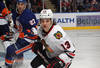 UNIONDALE, NY - DECEMBER 08:  Daniel Carcillo #13 of the Chicago Blackhawks skates against the New York Islanders at the Nassau Veterans Memorial Coliseum on December 8, 2011 in Uniondale, New York.  (Photo by Bruce Bennett/Getty Images)