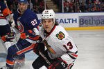 UNIONDALE, NY - DECEMBER 08:  Daniel Carcillo #13 of the Chicago Blackhawks skates against the New York Islanders at the Nassau Veterans Memorial Coliseum on December 8, 2011 in Uniondale, New York.  (Photo by Bruce Bennett/Getty Images)
