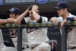 MINNEAPOLIS MN- AUGUST 27:  From left, Tsuyoshi Nishioka, Danny Valencia and Joe Mauer of the Minnesota Twins watch the final inning of their game against the Detroit Tigers as they lose 6-4 on August 27, 2011 at Target Field in Minneapolis, Minnesota. (Photo by Craig Lassig/Getty Images)