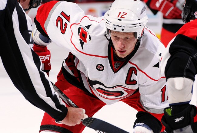 OTTAWA, ON - NOVEMBER 27:  Eric Staal #12 of the Carolina Hurricanes watches intently at a faceoff  in a game against the Ottawa Senators at Scotiabank Place on November 27, 2011 in Ottawa, Canada.  (Photo by Phillip MacCallum/Getty Images)