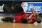 DENVER, CO - JANUARY 13:  Dwyane Wade #3 of the Miami Heat falls to the court with an injury in the fourth quarter against the Denver Nuggets at the Pepsi Center on January 13, 2012 in Denver, Colorado. Wade left the game after the injury as the Nuggets defeated the Heat 117-104. NOTE TO USER: User expressly acknowledges and agrees that, by downloading and or using this photograph, User is consenting to the terms and conditions of the Getty Images License Agreement.  (Photo by Doug Pensinger/Getty Images)