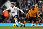 LONDON, ENGLAND - JANUARY 14: Rafael Van Der Vaart of Spurs goes past the challenge from Emmanuel Frimpong of Wolves during the Barclays Premier League match between Tottenham Hotspur and Wolverhampton Wanderers at White Hart Lane on January 14, 2012 in London, England.  (Photo by Ian Walton/Getty Images)