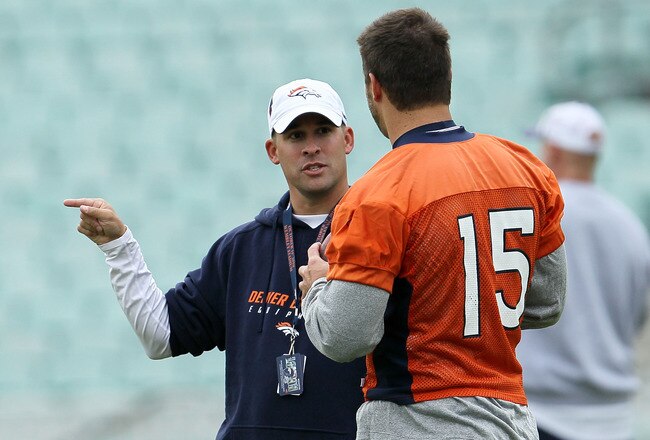 LONDON, ENGLAND - OCTOBER 29:  Head coach of the Denver Broncos Josh McDaniels talks with Tim Tebow #15  during a team training session at The Brit Oval on October 29, 2010 in London, England. The Denver Broncos will play the San Francisco 49ers at Wembley Stadium on October 31.  (Photo by Chris McGrath/Getty Images)