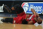 DENVER, CO - JANUARY 13:  Dwyane Wade #3 of the Miami Heat falls to the court with an injury in the fourth quarter against the Denver Nuggets at the Pepsi Center on January 13, 2012 in Denver, Colorado. Wade left the game after the injury as the Nuggets defeated the Heat 117-104. NOTE TO USER: User expressly acknowledges and agrees that, by downloading and or using this photograph, User is consenting to the terms and conditions of the Getty Images License Agreement.  (Photo by Doug Pensinger/Getty Images)