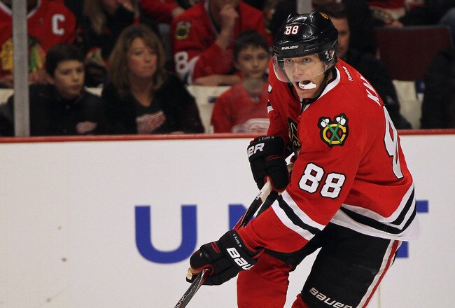 CHICAGO, IL - JANUARY 08:  Patrick Kane #88 of the Chicago Blackhawks controls the puck against the Detroit Red Wings at the United Center on January 8, 2012 in Chicago, Illinois. The Red Wings defeated the Blackhawks 3-2 in overtime.  (Photo by Jonathan Daniel/Getty Images)