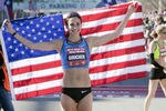 HOUSTON - JANUARY 14:  Kara Goucher poses with the American flag after qualifying in the U.S. Marathon Olympic Trials on January 14, 2012 in Houston, Texas.  (Photo by Bob Levey/Getty Images)