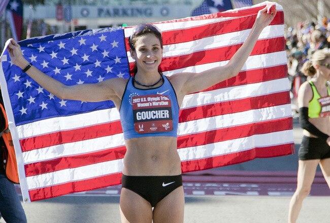 HOUSTON - JANUARY 14:  Kara Goucher poses with the American flag after qualifying in the U.S. Marathon Olympic Trials on January 14, 2012 in Houston, Texas.  (Photo by Bob Levey/Getty Images)