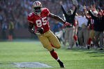 SAN FRANCISCO, CA - JANUARY 14:  Vernon Davis #85 of the San Francisco 49ers catches a 49 yard pass from Alex Smith #11 (not pictured) to score a touchdown in the first quarter against the New Orleans Saints during the NFC Divisional playoff game at Candlestick Park on January 14, 2012 in San Francisco, California.  (Photo by Thearon W. Henderson/Getty Images)