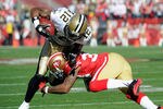 SAN FRANCISCO, CA - JANUARY 14:  Marques Colston #12 of the New Orleans Saints catches the ball for a first down against Dashon Goldson #38 of the San Francisco 49ers during the first quarter of the NFC Divisional playoff game at Candlestick Park on January 14, 2012 in San Francisco, California. (Photo by Thearon W. Henderson/Getty Images)