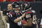 HOUSTON, TX - JANUARY 07:  (L-R) T.J. Yates #13 and Andre Johnson #80 of the Houston Texans celebrate after Johnson scored a 40-yard touchdown reception throw by Yates in the third quarter against the Cincinnati Bengals during their 2012 AFC Wild Card Playoff game at Reliant Stadium on January 7, 2012 in Houston, Texas.  (Photo by Jamie Squire/Getty Images)