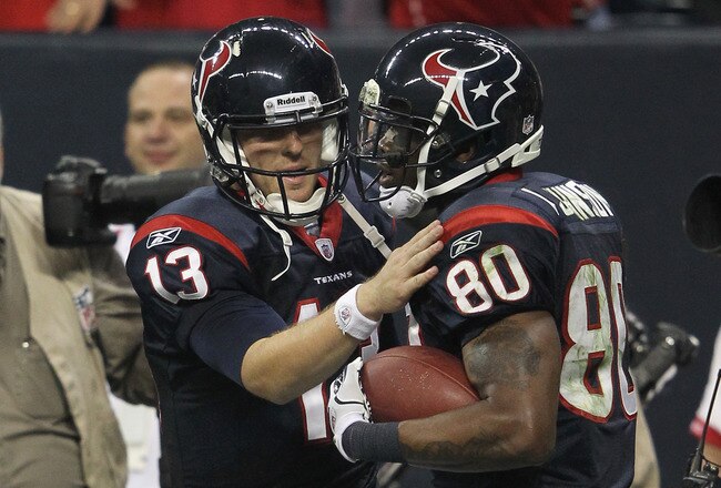 HOUSTON, TX - JANUARY 07:  (L-R) T.J. Yates #13 and Andre Johnson #80 of the Houston Texans celebrate after Johnson scored a 40-yard touchdown reception throw by Yates in the third quarter against the Cincinnati Bengals during their 2012 AFC Wild Card Playoff game at Reliant Stadium on January 7, 2012 in Houston, Texas.  (Photo by Jamie Squire/Getty Images)