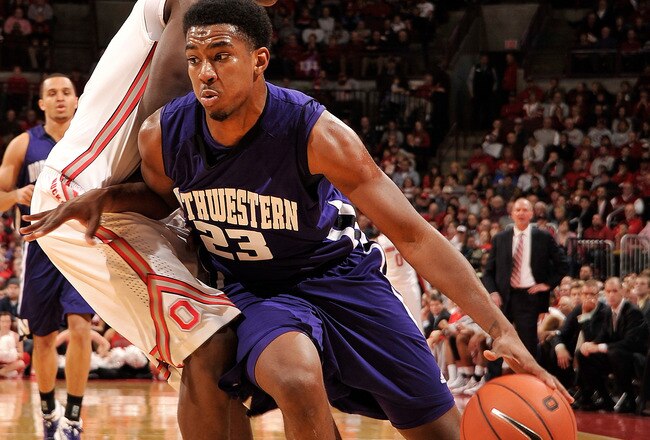 COLUMBUS, OH - DECEMBER 28:  JerShon Cobb #23 of the Northwestern Wildcats drives around Shannon Scott #3 of the Ohio State Buckeyes on December 28, 2011 at Value City Arena in Columbus, Ohio. Ohio State defeated Northwestern 87-54.   (Photo by Jamie Sabau/Getty Images)