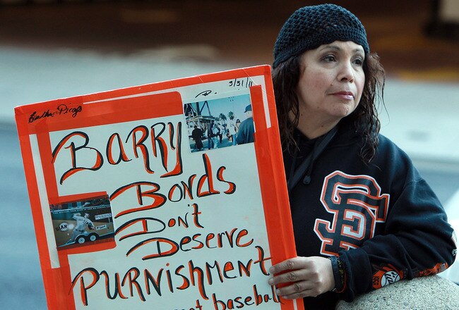 SAN FRANCISCO, CA - DECEMBER 16:  A fan of former Major League Baseball player Barry Bonds holds a sign outside of federal court on December 16, 2011 in San Francisco, California.  Former Major League Baseball player Barry Bonds was sentenced to 30 days of home confinement and two years probation after a jury found Barry Bonds guilty on one count of obstruction of justice and was a hung jury on three counts of perjury for lying to a grand jury about his use of performance enhancing drugs.  (Photo by Justin Sullivan/Getty Images)