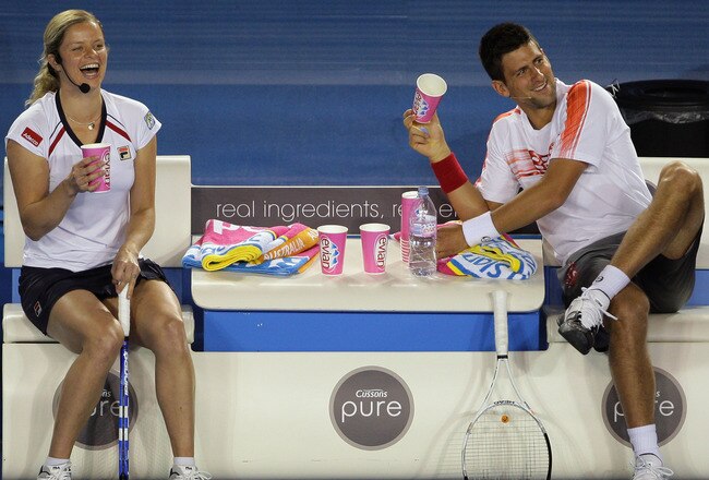 MELBOURNE, AUSTRALIA - JANUARY 17:  Kim Clijsters of Belgium and Novak Djokovic of Serbia and of the Red share a laugh during the 'Hit For Haiti' charity exhibition match ahead of the 2010 Australian Open at Melbourne Park on January 17, 2010 in Melbourne, Australia.  (Photo by Mark Dadswell/Getty Images)