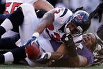 BALTIMORE, MD - OCTOBER 16:  Terrence Cody #62 of the Baltimore Ravens looses his helmet with tackling running back  Arian Foster #23 of the Houston Texans at M&T Bank Stadium on October 16, 2011 in Baltimore, Maryland. The Ravens won 29-14.  (Photo by Rob Carr/Getty Images)