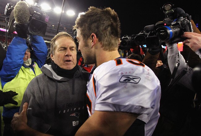 FOXBORO, MA - JANUARY 14:  Tim Tebow #15 (R) of the Denver Broncos congraulates head coach Bill Belichick of the New England Patriots after the Patriots won 45-10 during their AFC Divisional Playoff Game at Gillette Stadium on January 14, 2012 in Foxboro, Massachusetts.  (Photo by Al Bello/Getty Images)