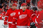 DETROIT, MI - JANUARY 12: Pavel Datsyuk #13 of the Detroit Red Wings celebrates with the bench after a Johan Franzen #93 third period goal while playing the Phoenix Coyotes at Joe Louis Arena on January 12, 2011 in Detroit, Michigan. Detroit won the game 3-2 in a shootout. (Photo by Gregory Shamus/Getty Images)