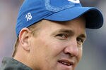FOXBORO, MA - DECEMBER 4:    Peyton Manning #18 of the Indianapolis Colts watches the action in the first half against the New England Patriots at Gillette Stadium on December 4, 2011 in Foxboro, Massachusetts. (Photo by Jim Rogash/Getty Images)