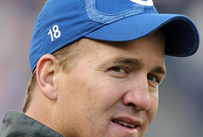 FOXBORO, MA - DECEMBER 4:    Peyton Manning #18 of the Indianapolis Colts watches the action in the first half against the New England Patriots at Gillette Stadium on December 4, 2011 in Foxboro, Massachusetts. (Photo by Jim Rogash/Getty Images)