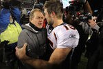 FOXBORO, MA - JANUARY 14:  Tim Tebow #15 (R) of the Denver Broncos congraulates head coach Bill Belichick of the New England Patriots after the Patriots won 45-10 during their AFC Divisional Playoff Game at Gillette Stadium on January 14, 2012 in Foxboro, Massachusetts.  (Photo by Jim Rogash/Getty Images)
