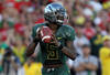 PASADENA, CA - JANUARY 02:  Quarterback Darron Thomas #5 of the Oregon Ducks is looking to pass while taking on the Wisconsin Badgers at the 98th Rose Bowl Game on January 2, 2012 in Pasadena, California.  (Photo by Stephen Dunn/Getty Images)