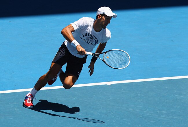 MELBOURNE, AUSTRALIA - JANUARY 15:  Novak Djokovic of Serbia chases a ball during practice ahead of the 2012 Australian Open at Rod Laver Arena on January 15, 2012 in Melbourne, Australia.  (Photo by Mark Dadswell/Getty Images)