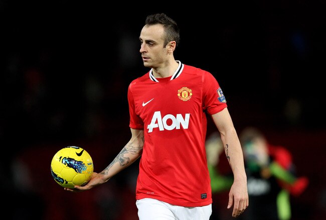 MANCHESTER, ENGLAND - DECEMBER 26:  Dimitar Berbatov of Manchester United walks off with the match ball after scoring a hat trick at the end of the Barclays Premier League match between Manchester United and Wigan Athletic at Old Trafford on December 26, 2011 in Manchester, England.  (Photo by Alex Livesey/Getty Images)