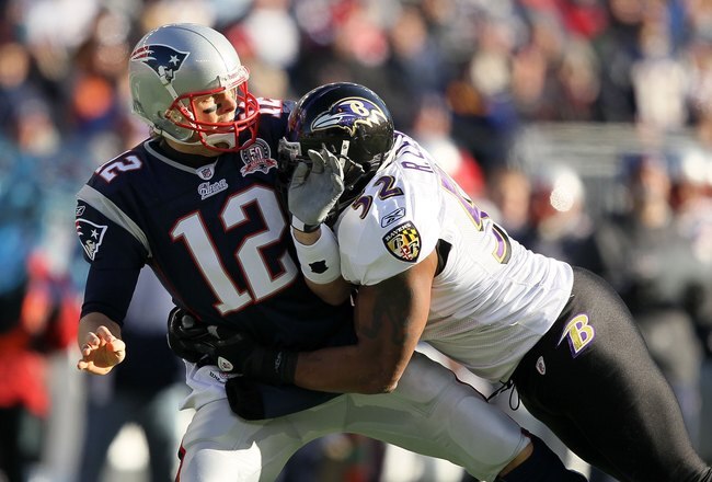 FOXBORO, MA - JANUARY 10:  Quarterback Tom Brady #12 of the New England Patriots is hit by Ray Lewis #52 of the Baltimore Ravens during the 2010 AFC wild-card playoff game at Gillette Stadium on January 10, 2010 in Foxboro, Massachusetts. The Ravens won 33-14.  (Photo by Al Bello/Getty Images)