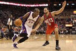 PHOENIX, AZ - JANUARY 13:  Michael Redd #22 of the Phoenix Suns handles the ball under pressure from Deron Williams #8 of the New Jersey Nets during the NBA game at US Airways Center on January 13, 2012 in Phoenix, Arizona. The Nets defeated the Suns 110-103. NOTE TO USER: User expressly acknowledges and agrees that, by downloading and or using this photograph, User is consenting to the terms and conditions of the Getty Images License Agreement.  (Photo by Christian Petersen/Getty Images)