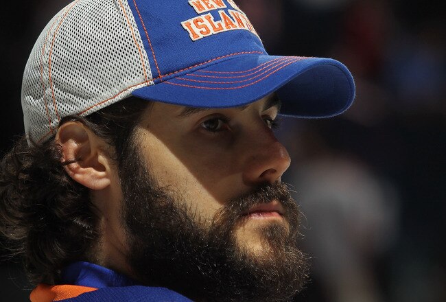 UNIONDALE, NY - OCTOBER 10: Rick DiPietro #39 of the New York Islanders takes part in the team's celebration following their 2-1 victory over the Minnesota Wild at Nassau Veterans Memorial Coliseum on October10, 2011 in Uniondale, New York.  (Photo by Bruce Bennett/Getty Images)