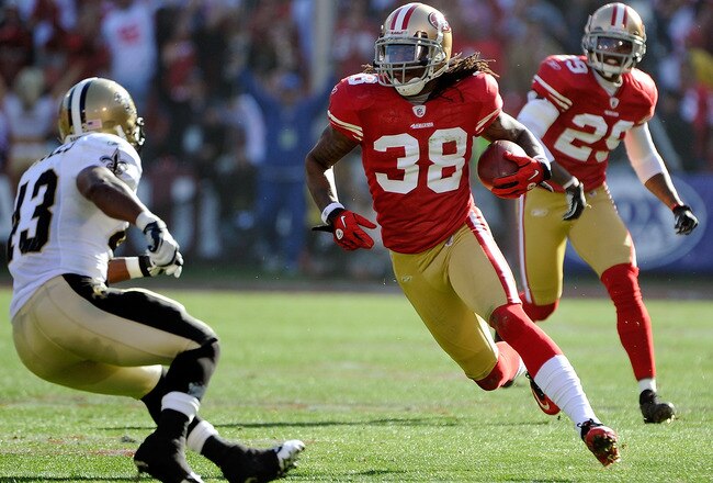 SAN FRANCISCO, CA - JANUARY 14: Dashon Goldson #38 of the San Francisco 49ers returns an interception looking to put a move on Darren Sproles #43 of the New Orleans Saints during the Divisional Playoffs at Candlestick Park on January 14, 2012 in San Francisco, California.  (Photo by Thearon W. Henderson/Getty Images)