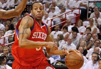 MIAMI, FL - APRIL 27:  Andre Iguodala #9 of the Philadelphia 76ers drives to the rim past Mario Chalmers #15 of the Miami Heat  during game five of the Eastern Conference Quarterfinals in the 2011 NBA Playoffs at American Airlines Arena on April 27, 2011 in Miami, Florida. NOTE TO USER: User expressly acknowledges and agrees that, by downloading and/or using this Photograph, User is consenting to the terms and conditions of the Getty Images License Agreement.  (Photo by Mike Ehrmann/Getty Images)