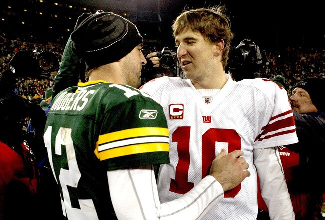 GREEN BAY, WI - DECEMBER 26:  Aaron Rodgers #12 of the Green Bay Packers is congratulated by Eli Manning #10 of the New York Giants after their game at Lambeau Field on December 26, 2010 in Green Bay, Wisconsin.  (Photo by Matthew Stockman/Getty Images)