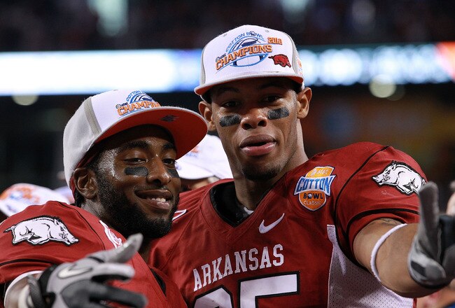 ARLINGTON, TX - JANUARY 06:  (L-R) Joe Adams #3 and Greg Childs #85 of the Arkansas Razorbacks celebrate a win against the Kansas State Wildcats during the Cotton Bowl at Cowboys Stadium on January 6, 2012 in Arlington, Texas.  (Photo by Ronald Martinez/Getty Images)