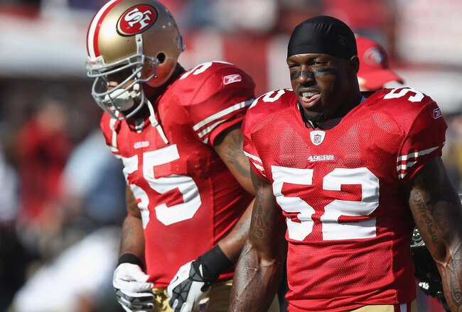 SAN FRANCISCO, CA - JANUARY 14: Ahmad Brooks #55 (L) and Patrick Willis #52 (R) of the San Francisco 49ers takes the field for the start of the NFC Divisional playoff game against the New Orleans Saints at Candlestick Park on January 14, 2012 in San Francisco, California.  (Photo by Jed Jacobsohn/Getty Images)