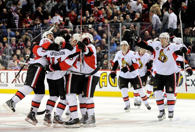 MONTREAL, CANADA - JANUARY 14:  Members of the Ottawa Senators celebrate the game winning goal by teammate Daniel Alfredsson #11 during the NHL game against the Montreal Canadiens at the Bell Centre on January 14, 2012 in Montreal, Quebec, Canada.  The Senators defeated the Canadiens 3-2 in a shootout.  (Photo by Richard Wolowicz/Getty Images)
