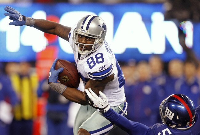 EAST RUTHERFORD, NJ - JANUARY 1:  Dez Bryant #88 of the Dallas Cowboys attempts to get by Jacquian Williams #57 of the New York Giants during a game at MetLife Stadium on January 1, 2012 in East Rutherford, New Jersey. (Photo by Rich Schultz /Getty Images)