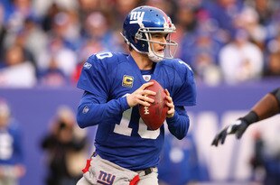 EAST RUTHERFORD, NJ - JANUARY 08:  Eli Manning #10 of the New York Giants looks to pass in the first quarter against the Atlanta Falcons during their NFC Wild Card Playoff game at MetLife Stadium on January 8, 2012 in East Rutherford, New Jersey.  (Photo by Al Bello/Getty Images)