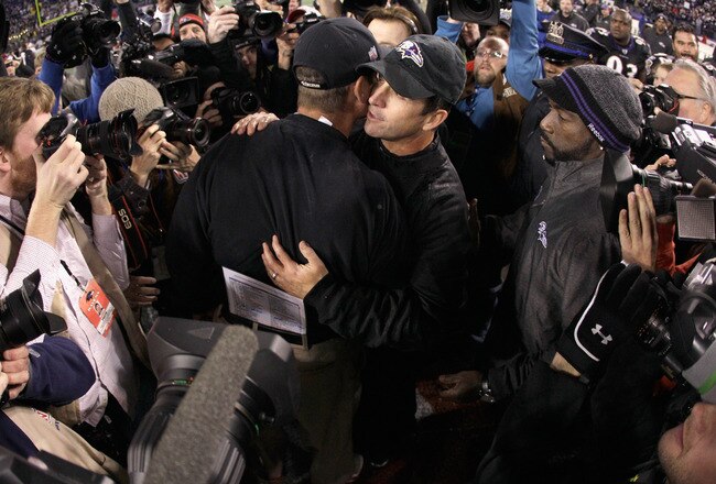 BALTIMORE, MD - NOVEMBER 24:  Head coach Jim Harbaugh of the San Francisco 49ers (L) hugs his brother head coach John Harbaugh of the Baltimore Ravens (R) after the Ravens defeated the 49ers 16-6 at M&T Bank Stadium on November 24, 2011 in Baltimore, Maryland.  (Photo by Rob Carr/Getty Images)