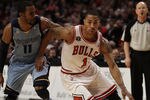 CHICAGO, IL - MARCH 25: Derrick Rose #1 of the Chicago Bulls drives against Mike Conley #11 of the Memphis Grizzlies at the United Center on March 25, 2011 in Chicago, Illinois. The Bulls defeated the Grizzlies 99-96. NOTE TO USER: User expressly acknowledges and agrees that, by downloading and/or using this photograph, User is consenting to the terms and conditions of the Getty Images License Agreement. (Photo by Jonathan Daniel/Getty Images)