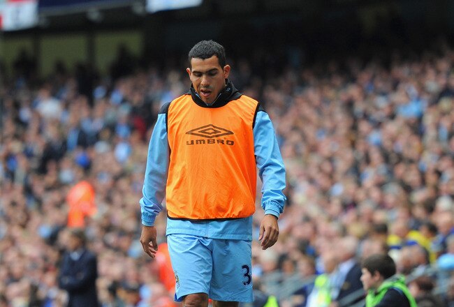 MANCHESTER, ENGLAND - SEPTEMBER 24:  Carlos Tevez of Manchester City looks on from the sidelines during the Barclays Premier League match between Manchester City and Everton at the Etihad Stadium on September 24, 2011 in Manchester, England.  (Photo by Michael Regan/Getty Images)