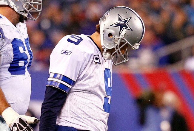 EAST RUTHERFORD, NJ - JANUARY 01:   Tony Romo #9 of the Dallas Cowboys walks back to the bench against the New York Giants at MetLife Stadium on January 1, 2012 in East Rutherford, New Jersey.  (Photo by Jeff Zelevansky/Getty Images)