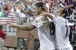 DETROIT, MI - JUNE 7: Clint Dempsey #8 of the United States celebrates a second half goal with Landon Donovan #10 while playing Canada during the 2011 Gold Cup  at Ford Field on June 7, 2011 in Detroit, Michigan. The United States won the game 2-0. (Photo by Gregory Shamus/Getty Images)