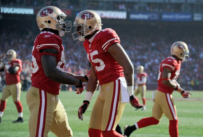 SAN FRANCISCO, CA - JANUARY 14:  Vernon Davis #85 of the San Francisco 49ers celebrates after his touchdown with Michael Crabtree #15 against the New Orleans Saints during the NFC Divisional playoff game at Candlestick Park on January 14, 2012 in San Francisco, California.  (Photo by Thearon W. Henderson/Getty Images)