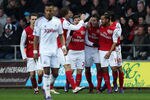 SWANSEA, WALES - JANUARY 15: Robin van Persie of Arsenal celebrates his opening goal with team mates during the Barclays Premier League match between Swansea City and Arsenal at Liberty Stadium on January 15, 2012 in Swansea, Wales.  (Photo by Michael Steele/Getty Images)