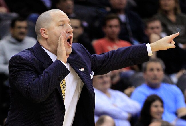 NEWARK, NJ - MARCH 25:  Head coach Buzz Williams of the Marquette Golden Eagles reacts after a play against the North Carolina Tar Heels during the first half the east regional semifinal of the 2011 NCAA Men's Basketball Tournament at the Prudential Center on March 25, 2011 in Newark, New Jersey.  (Photo by Chris Trotman/Getty Images)