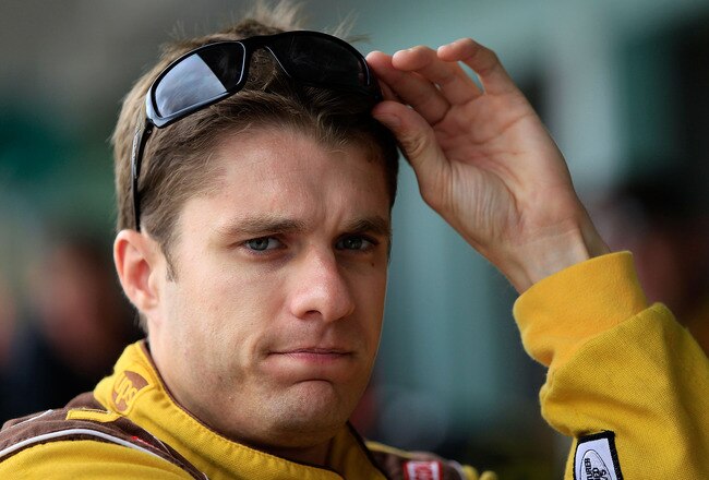 HOMESTEAD, FL - NOVEMBER 18:  David Ragan, driver of the #6 UPS My Choice Ford, looks on from the garage area during practice for the NASCAR Sprint Cup Series Ford 400 at Homestead-Miami Speedway on November 18, 2011 in Homestead, Florida.  (Photo by Chris Trotman/Getty Images for NASCAR)