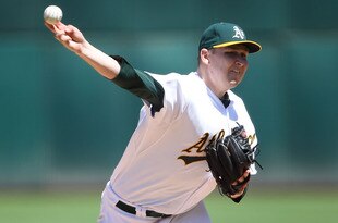 OAKLAND, CA - AUGUST 13:  Trevor Cahill #53 of the Oakland Athletics pitches against the Texas Rangers at O.co Coliseum on August 13, 2011 in Oakland, California.  (Photo by Jed Jacobsohn/Getty Images)