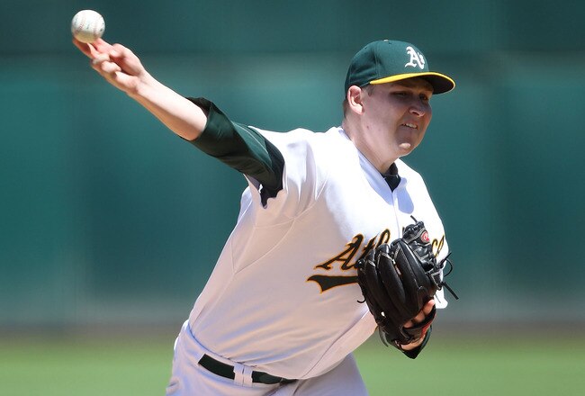 OAKLAND, CA - AUGUST 13:  Trevor Cahill #53 of the Oakland Athletics pitches against the Texas Rangers at O.co Coliseum on August 13, 2011 in Oakland, California.  (Photo by Jed Jacobsohn/Getty Images)